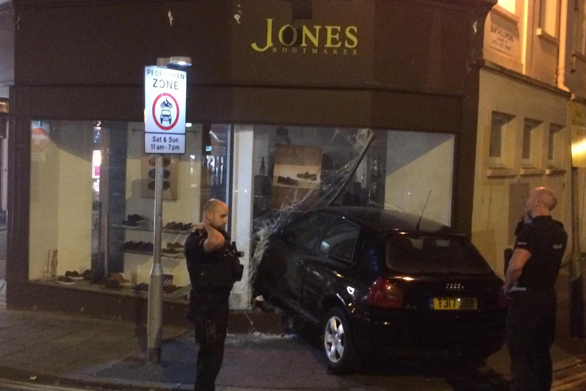 Four arrested after police chase ends with car crashing into Brighton shopfront