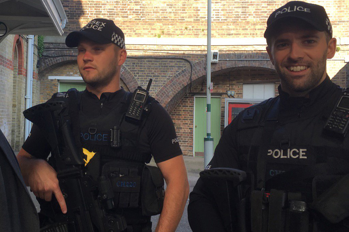Armed police officers patrolling Sussex stations