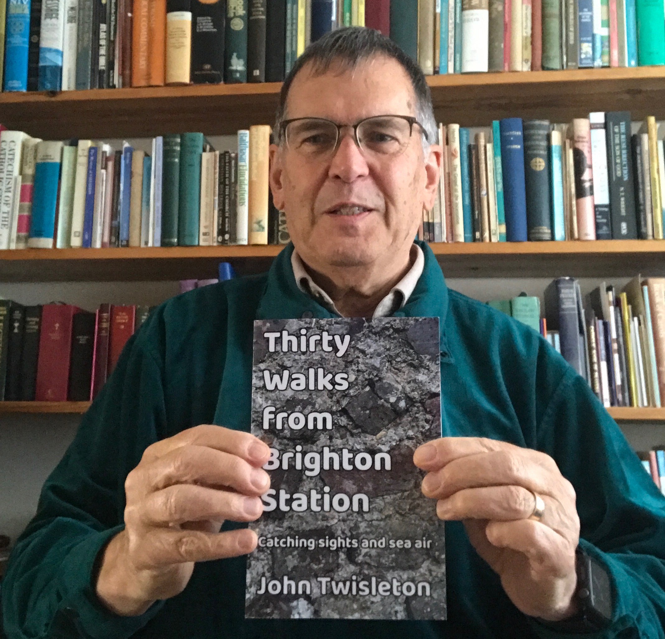 John Twisleton with his book Thirty Walks from Brighton Station - Catching Sights and Sea Air