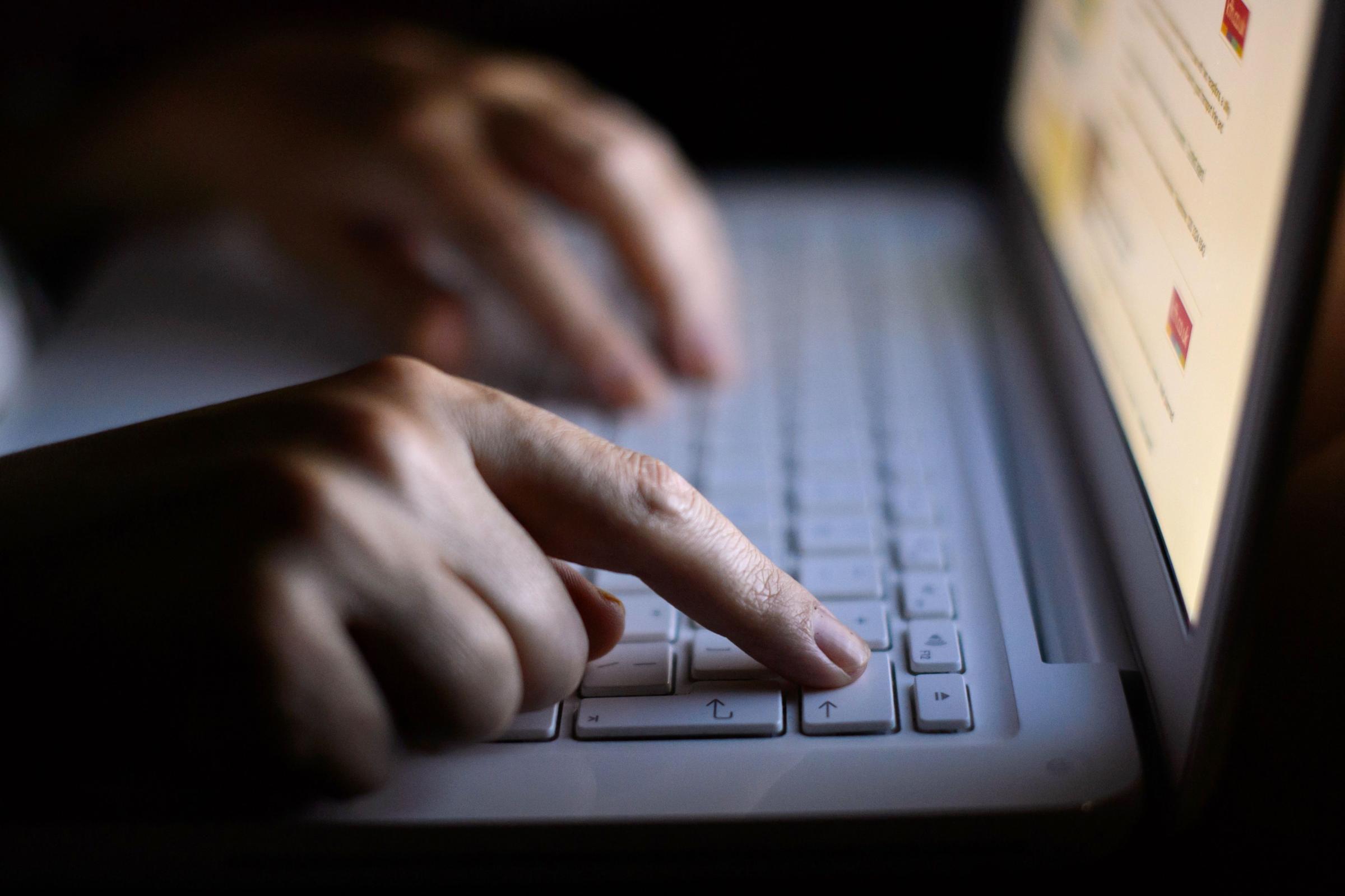 File photo dated 06/08/13 of a someone using a laptop as the number of children being counselled through ChildLine about online sexual abuse has more than doubled, according to the charity. PRESS ASSOCIATION Photo. Issue date: Friday February 13, 2015.