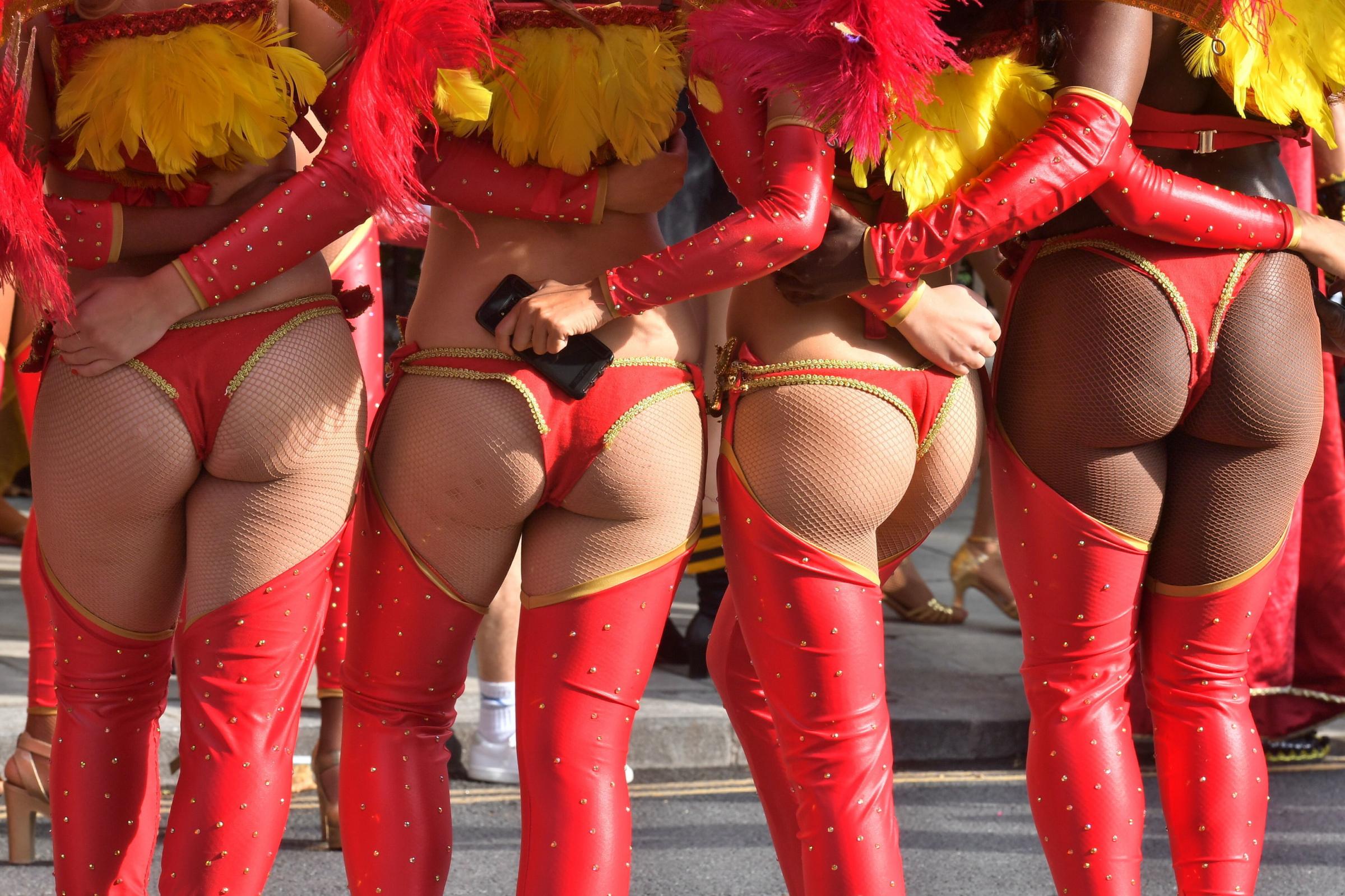 Dancers prepare to take part in the Notting Hill Carnival in west London..